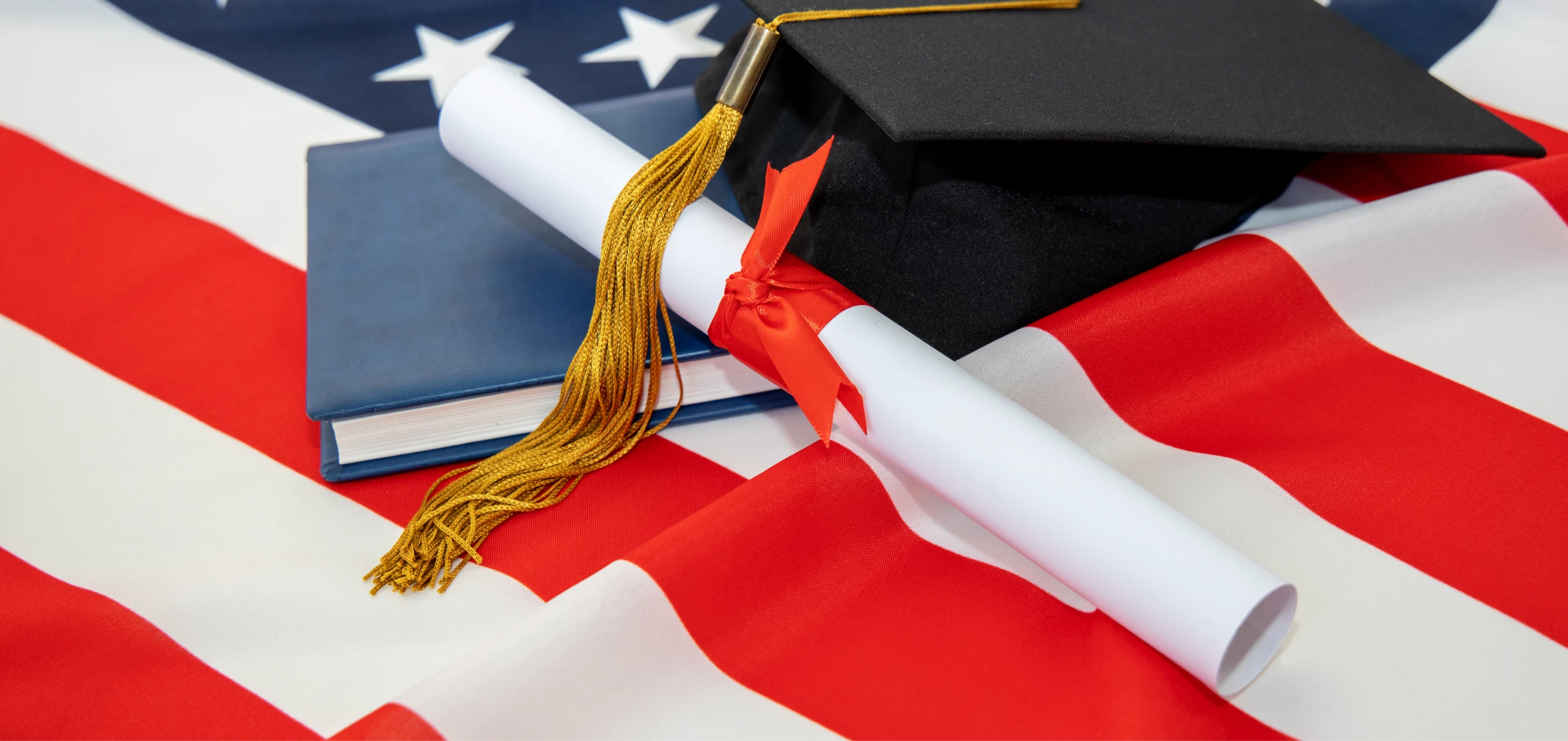 Diploma and cap atop U.S. flag